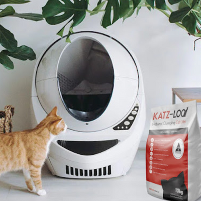 Cat with Automatic Litter Tray and bag of Katz Loo cat litter